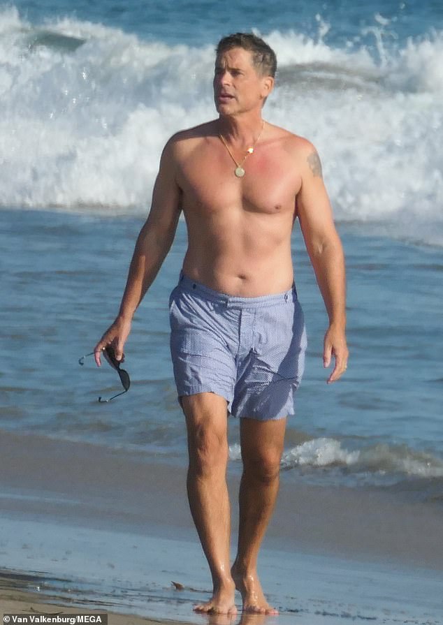 Rob Lowe, 56, bares his muscles as he goes shirtless for a walk on the ...